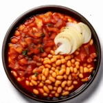 A bowl of smoky bean stew with a rich, flavorful broth, garnished with fresh herbs.